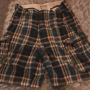 A pair of plaid shorts for men with roomy pockets